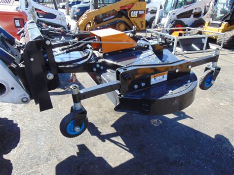 wolverine skid steer spreader|wolverine skid steer attachments.